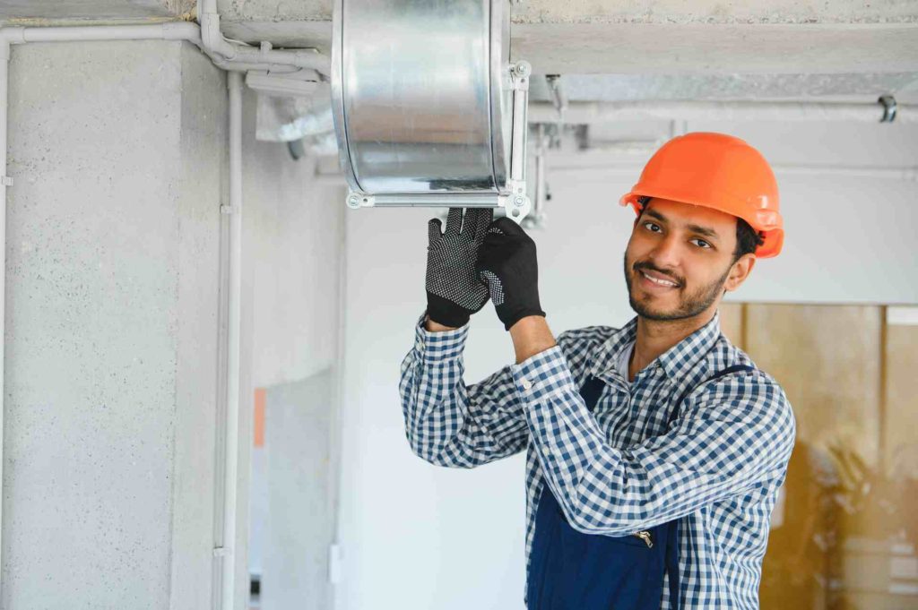 Worker installing HVAC Air Duct Pakistan